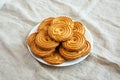 Homemade Sprits Biscuits on a Plate, side view