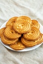 Homemade Sprits Biscuits on a Plate, side view