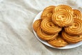 Homemade Sprits Biscuits on a Plate, side view. Space for text