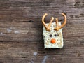 Homemade square bars of Rice Crispy Decorate Christmas reindeer on the wooden table Royalty Free Stock Photo