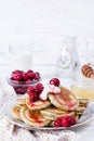 Homemade stack of pancakes with cherries for tasty healthy breakfast Royalty Free Stock Photo
