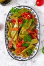 Homemade stewed green beans, tomatoes, garlic with olive oil. Zeytinyagli fasulye traditional food. Turkish cuisine. Top view, Royalty Free Stock Photo