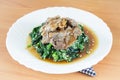 Homemade stir fried spinach, meat with coconut butter, garlic, soy sauce
