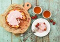 Homemade strawberry cake with cream glaze served with fresh berries and black tea Royalty Free Stock Photo