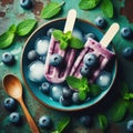 Homemade strawberry cherry banana blueberry ice cream green mint leaves on teal rustic table, frozen fruit juice Royalty Free Stock Photo