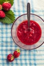 Homemade strawberry jam (marmelade). glass bowl with hot jam and fresh strawberries