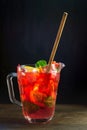 Homemade strawberry lemonade in a jar on black background Royalty Free Stock Photo