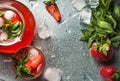Homemade strawberry lemonade with mint, ice and fresh berries over metal tray background, top view, copy space Royalty Free Stock Photo
