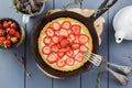 Homemade strawberry pie with whipped cream in cast iron skillet Royalty Free Stock Photo