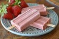 Homemade strawberry popsicles. Frozen fruit juice. Generative AI Royalty Free Stock Photo