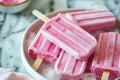 Homemade strawberry popsicles. Frozen fruit juice. Generative AI Royalty Free Stock Photo