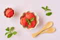 Homemade strawberry, red berry  ice cream , sorbet with  mint leaves on pastel pink background. Top view Royalty Free Stock Photo