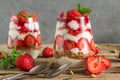 Homemade strawberry yogurt parfait with granola, mint and fresh berries in glasses on rustic wooden table Royalty Free Stock Photo