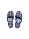 Homemade striped gray slippers on a white background