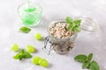 Homemade sugar scrub with chopped mint leaves, mint candies and essential mint Royalty Free Stock Photo