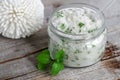 Homemade sugar scrub with vegetable oil, chopped mint leaves and essential mint oil Royalty Free Stock Photo