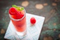 Homemade summer cold raspberry cocktail with crushed iced and alcohol in glasses on a vintage background Royalty Free Stock Photo