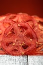 Homemade Sun Dried Tomatoes. Chips from tomatoes on a white wooden table Royalty Free Stock Photo