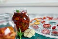 Homemade sun dried tomatoes with herbs, garlic in olive oil in a glass jar Royalty Free Stock Photo