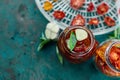 Homemade sun dried tomatoes with herbs, garlic in olive oil in a glass jar Royalty Free Stock Photo
