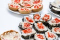 Homemade sushi covered with red caviar on a festive table, Japanese food, holidays Royalty Free Stock Photo