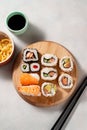 Homemade sushi rolls with salmon, shrimp, avocado. Top view of assorted sushi. Royalty Free Stock Photo