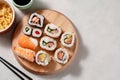 Homemade sushi rolls with salmon, shrimp, avocado. Top view of assorted sushi. Copy space Royalty Free Stock Photo