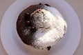 Homemade sweet cholocate cake with powdered sugar and berrys served for coffee top view Royalty Free Stock Photo