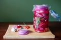 Homemade sweet and spicy pickled red onions sliced in a large glass jar, Royalty Free Stock Photo