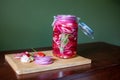 Homemade sweet and spicy pickled red onions sliced in a large glass jar Royalty Free Stock Photo