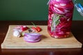 Homemade sweet and spicy pickled red onions sliced in a large glass jar, with the ingredients beside Royalty Free Stock Photo