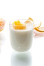Homemade sweet yogurt in a glass with oranges