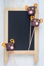 Homemade sweetness made with marshmallow, chocolate and pretzel on chalkboard, copy space