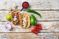 Homemade taco with chicken and beef near raw ingredients over white textured old table, top view with space for text