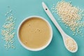 Homemade tahini or tahina, paste from ground sesame seeds on blue vintage surface Royalty Free Stock Photo