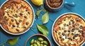 Homemade tart with olives on blue wooden background with fresh lemon, fresh olives, lemon leaves and fig jam . Royalty Free Stock Photo