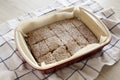 Homemade Tasty Applesauce Cake on a white wooden surface, low angle view. Close-up