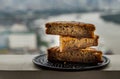 Homemade tasty banana cake slices on Black ceramic plate with city view Royalty Free Stock Photo