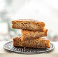 Homemade tasty banana cake slices on Black ceramic plate with city view Royalty Free Stock Photo