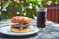 Homemade tasty and juicy beef burger served with cola drink on the vintage white porcelan plate.