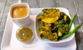 Homemade tasty Palak pakoda or pakora known as Spinach Firtters, served with ketchup & tea. Favourite Tea-time snack from India Royalty Free Stock Photo