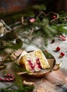 Slice of biscuit sponge cake with white cream and cherry sauce inside on copper vintage plate Royalty Free Stock Photo