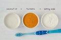 Homemade teeth whitening recipe made out of coconut oil, turmeric and baking soda Royalty Free Stock Photo