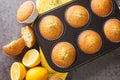 Homemade tender muffins with poppy seeds and lemon close-up in a metal muffin pan. horizontal top view Royalty Free Stock Photo