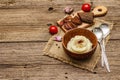 Homemade Thanksgiving garlic mashed potatoes with fresh tomatoes and pastrami. Sackcloth napkin, spoons, old wooden boards Royalty Free Stock Photo