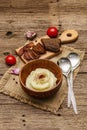 Homemade Thanksgiving garlic mashed potatoes with fresh tomatoes and pastrami. Sackcloth napkin, spoons, old wooden boards Royalty Free Stock Photo