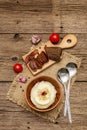 Homemade Thanksgiving garlic mashed potatoes with fresh tomatoes and pastrami. Sackcloth napkin, spoons, old wooden boards Royalty Free Stock Photo