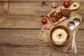 Homemade Thanksgiving garlic mashed potatoes with fresh tomatoes and pastrami. Sackcloth napkin, spoons, old wooden boards Royalty Free Stock Photo