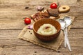 Homemade Thanksgiving garlic mashed potatoes with fresh tomatoes and pastrami. Sackcloth napkin, spoons, old wooden boards Royalty Free Stock Photo