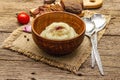 Homemade Thanksgiving garlic mashed potatoes with fresh tomatoes and pastrami. Sackcloth napkin, spoons, old wooden boards Royalty Free Stock Photo